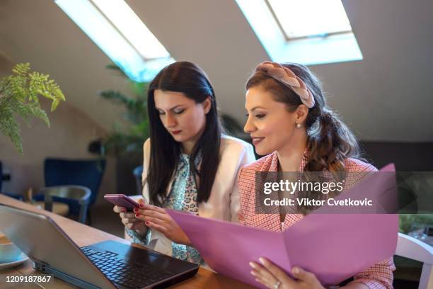 young business women using laptop for online shopping - aleksandra cvetkovic stock pictures, royalty-free photos & images