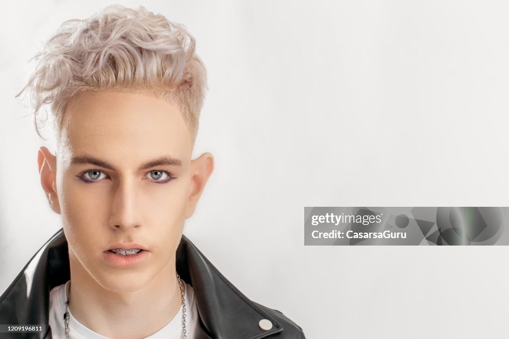 Closeup Portrait Of Stylish Teenage Boy With Platinum Blonde Half Shaved  Hairstyle Against White Background Stock Photo High-Res Stock Photo - Getty  Images