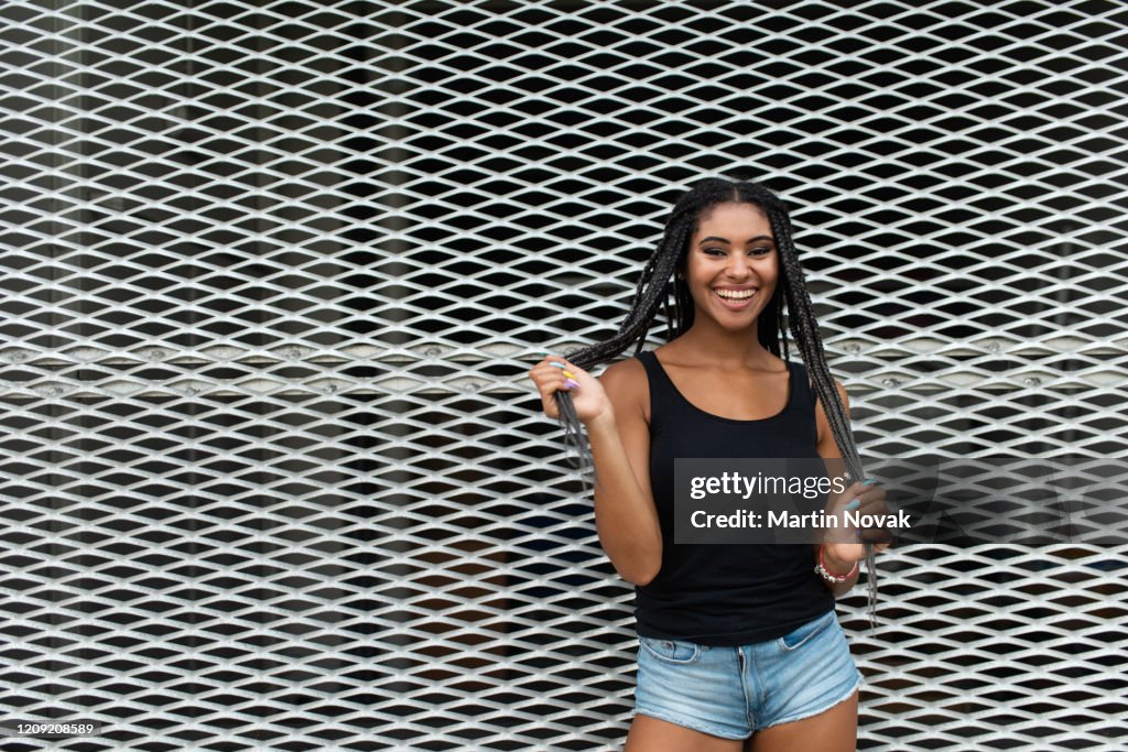 Mixed race woman flaunting her new hairstyle