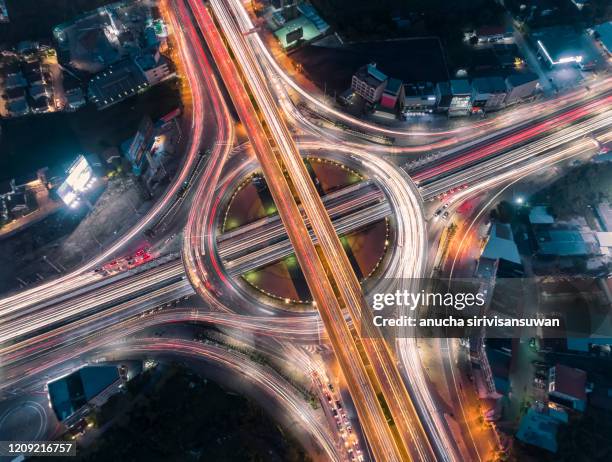 aerial top view of bangkok roundabout road at night, thailand. - busy highway stock pictures, royalty-free photos & images