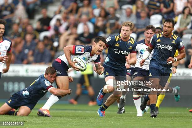 Matt Toomua of the Rebels looks to pass during the round five Super Rugby match between the Highlanders and the Rebels at Forsyth Barr Stadium on...