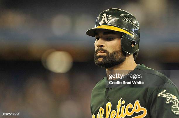 Conor Jackson of the Oakland Athletics looks on during the game against the Toronto Blue Jays August 9, 2011 at Rogers Centre in Toronto, Ontario,...