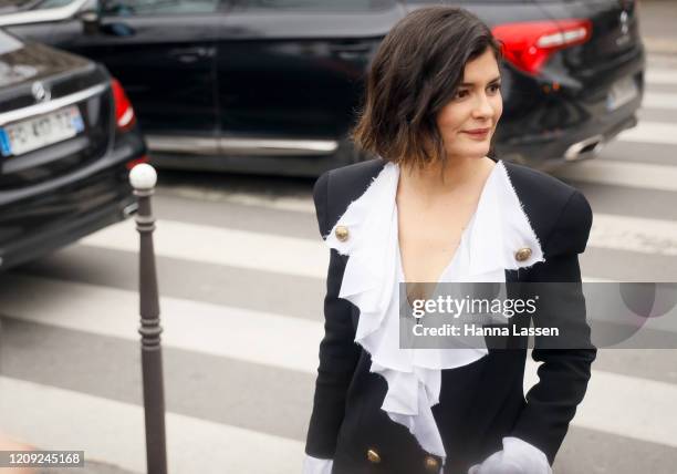 Audrey Tautou wearing Balmain black blazer and white frill blouse outside the Balmain show during the Paris Fashion Week Womenswear Fall/Winter on...