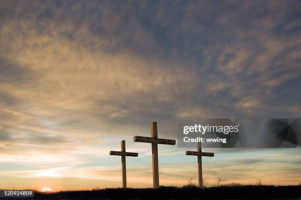three crosses on good friday with setting sun and  copy. - the crucifixion stockfoto's en -beelden