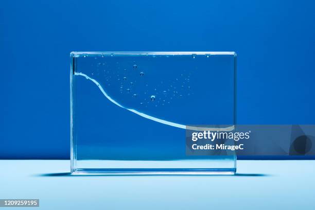 water wave in glass box abstract line graph - line graph down stock pictures, royalty-free photos & images