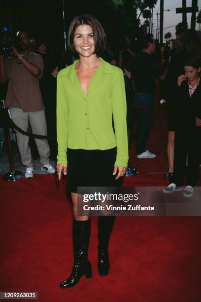 American actress Lori Loughlin attends the premiere of 'The Arrival' at the Academy Theater in Beverly Hills, California, 21st May 1996.