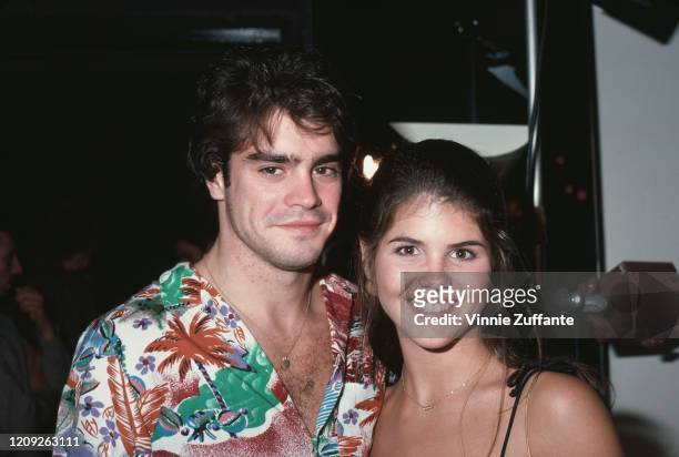 American actor Mark Arnold, wearing a Hawaiian shirt, with American actress Lori Loughlin, September 1981.