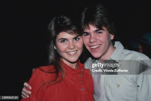 American actress Lori Loughlin and her brother, Roy Loughlin, attend a party for Felice Schachter at Studio 54 in New York City, New York, circa 1985.