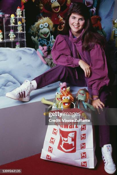 American actress Lori Loughlin attends the opening of the 'Muppet Boutique' at FAO Schwarz in New York City, New York, 8th April 1984.