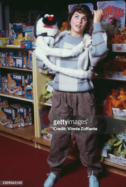 American actress Lori Loughlin attends the opening of the 'Muppet Boutique' at FAO Schwarz in New York City, New York, 8th April 1984.