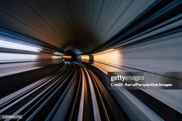 pov long exposure of dubai subway tunnel - train vehicle stock pictures, royalty-free photos & images