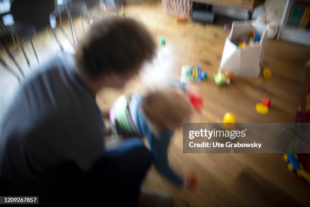 In this photo illustration a father violently stops his child. On April 02, 2020 in Bonn, Germany.