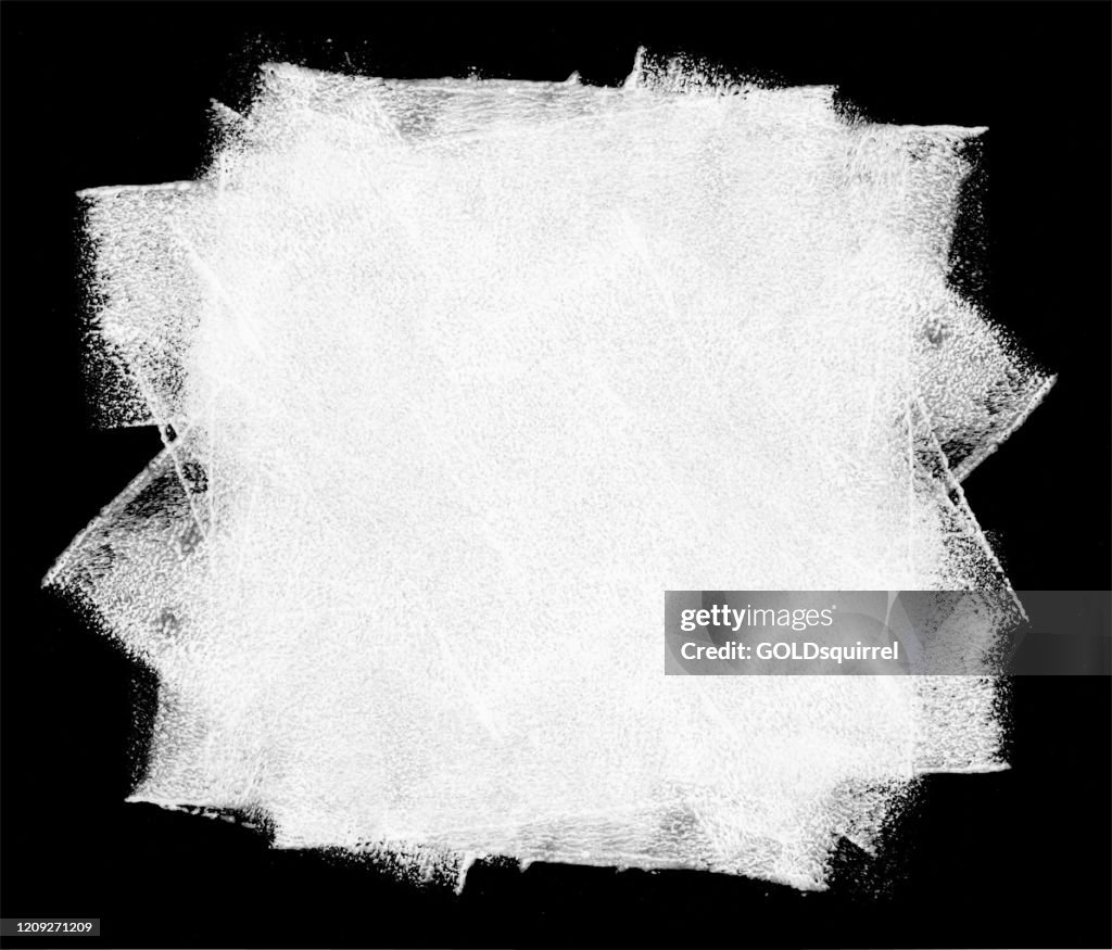 Rolled out big stain of white paint on a black background by hand and paint roller - abstract vector illustration with visible uneven irregular wide traces of paint and multilayered effects