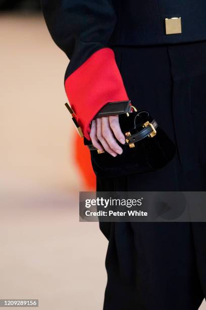 Caroline Ribeiro, bag detail, walks the runway during the Balmain show as part of the Paris Fashion Week Womenswear Fall/Winter 2020/2021 on February...