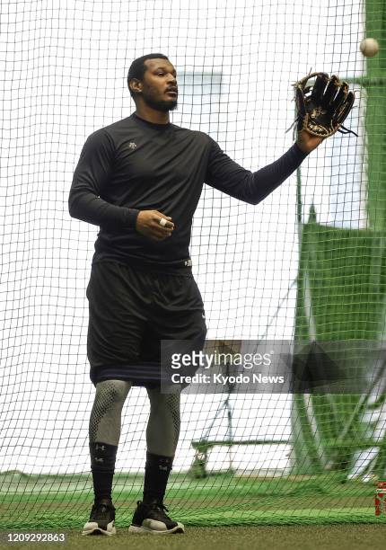 Orix Buffaloes outfielder Adam Jones plays catch during personal workout in Osaka on April 6, 2020.