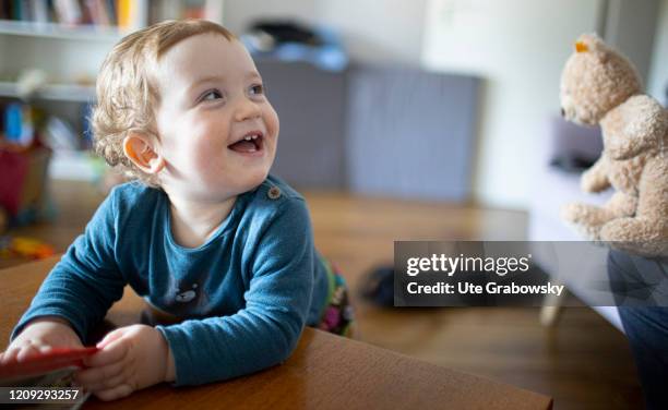 In this photo illustration a boy is laughing on April 02, 2020 in Bonn, Germany.