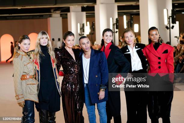 Erin Wasson, Julia Hengel, Helena Christensen, Olivier Rousteing, Caroline Ribeiro, Esther Canadas and Liya Kebede acknowledge the applause of the...