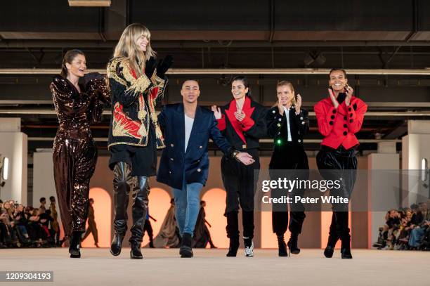 Helena Christensen, Julia Stegner, Olivier Rousteing, Caroline Ribeiro, Esther Cañadas and Liya Kebede walk the runway during the Balmain show as...