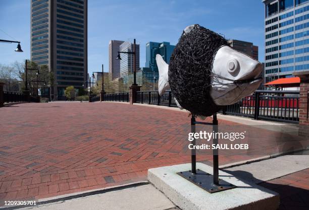 Normally busy area of Baltimore's Inner Harbor near the National Aquarium is seen in Maryland, April 6 as the state continues a stay-at-home order...