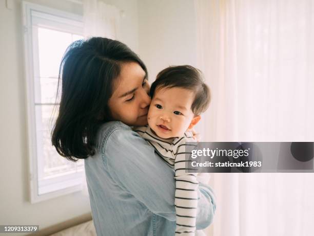 Mother Rocking Mother Rocking Baby Photos and Premium High Res Pictures - Getty Images