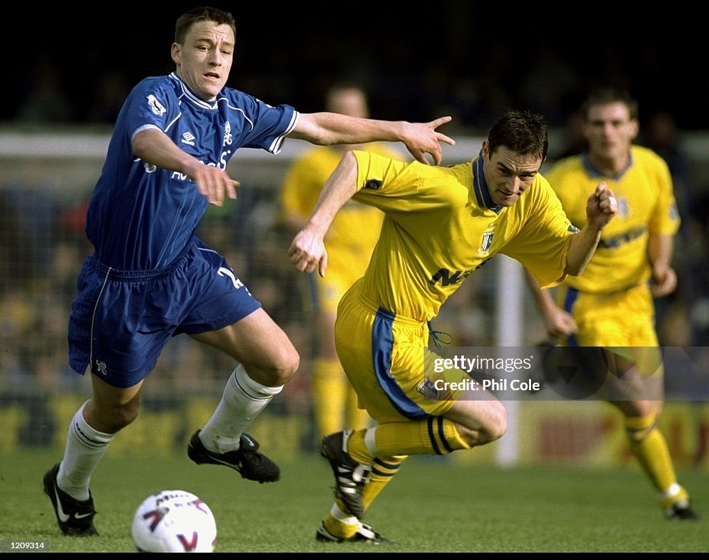 John Terry of Chelsea and Andy Thomson of Gillingham