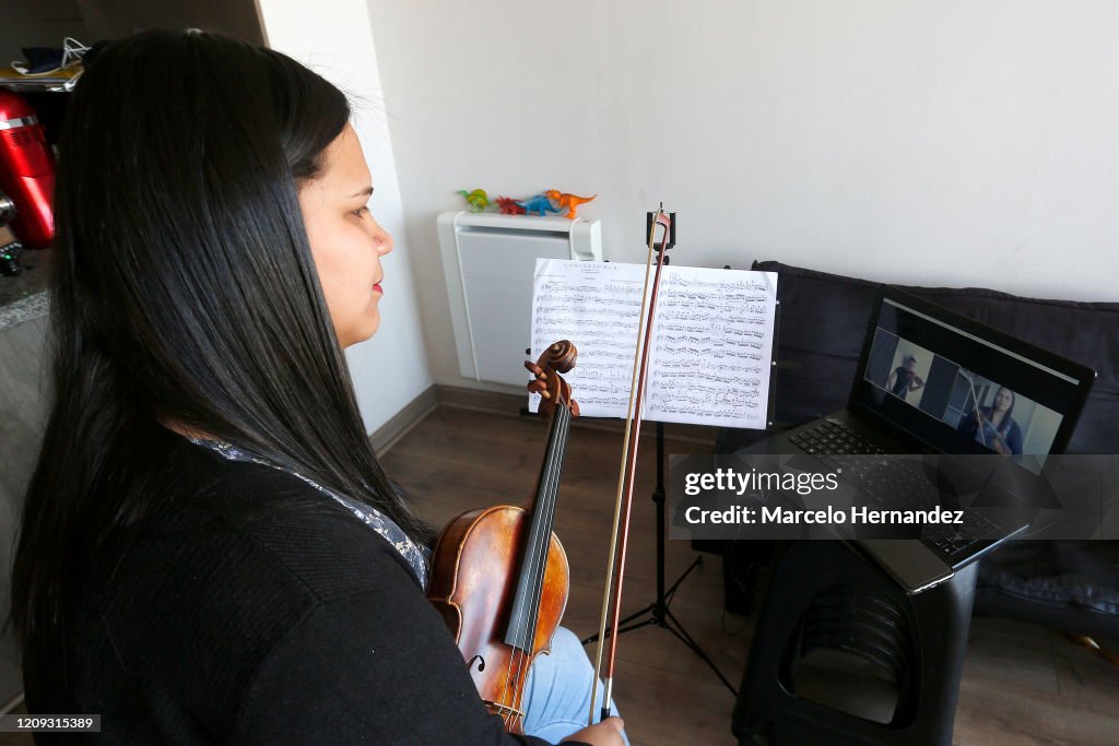 Violin Teacher Conducts Online Lessons From Home During Coronavirus Partial Shutdown