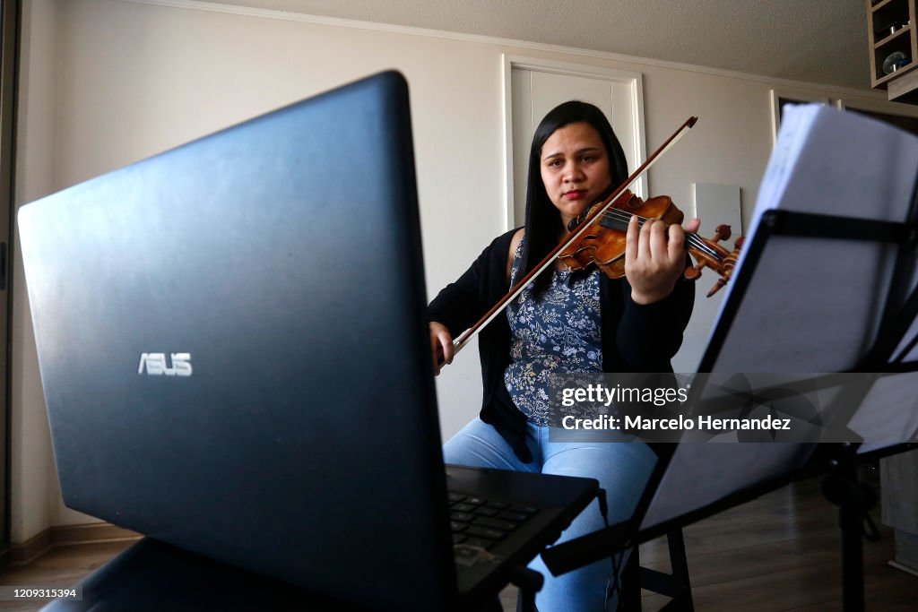 Violin Teacher Conducts Online Lessons From Home During Coronavirus Partial Shutdown