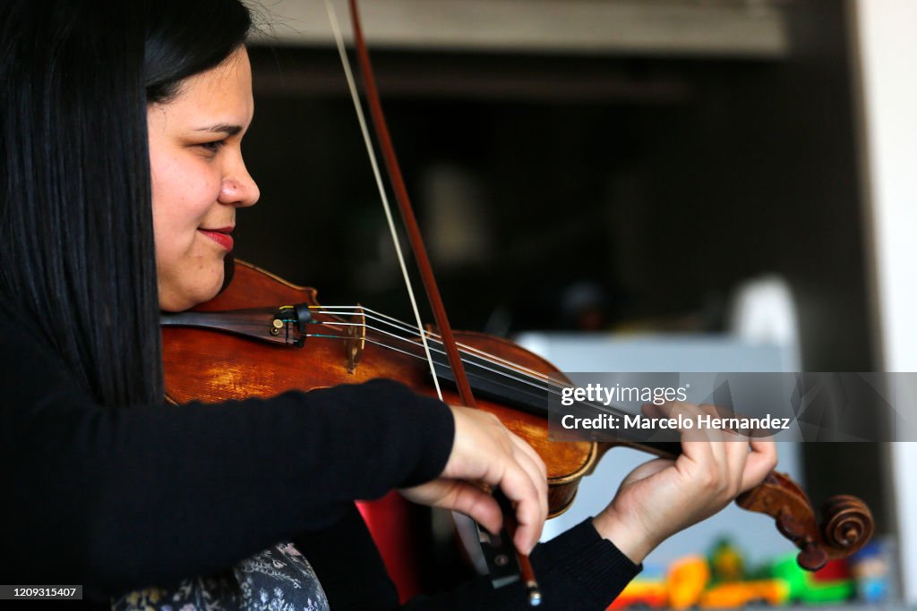 Violin Teacher Conducts Online Lessons From Home During Coronavirus Partial Shutdown