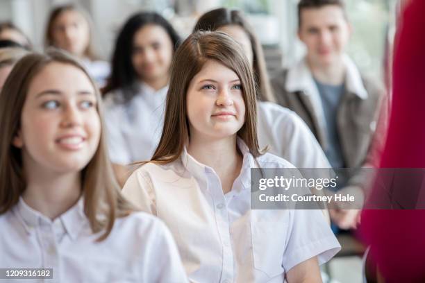 high school student smiles during seminar - high school senior stock pictures, royalty-free photos & images