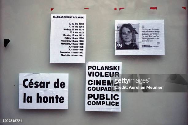 Feminist activists tracts showing actress Adele Haenel and anti Polanski are glued on a wall next to the Cesar Film Awards Ceremony to protest...