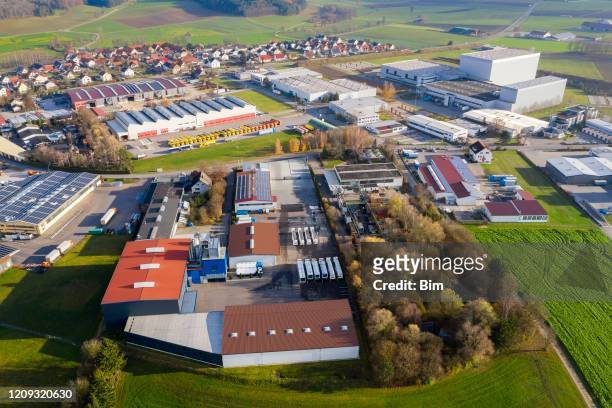 industrial area, trucks at warehouse, aerial view - zona industrial imagens e fotografias de stock