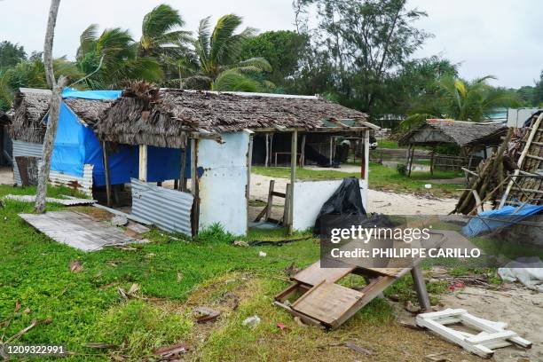 Badly damaged buildings are pictured near Vanuatu's capital of Port Vila on April 7 after Tropical Cyclone Harold swept past and hit islands to the...