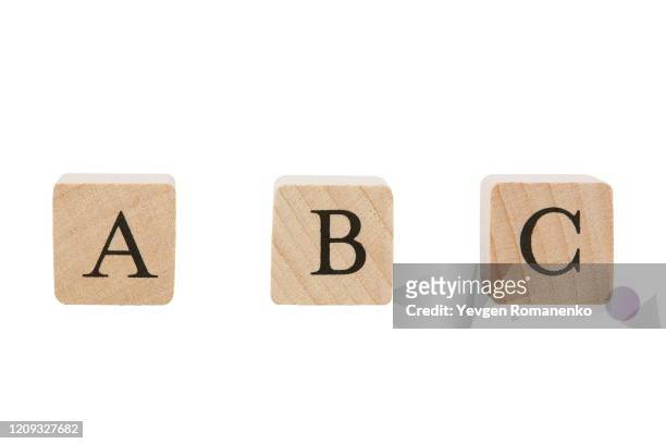 a b c word made of wooden cubes, isolated on white background - a to b stock-fotos und bilder