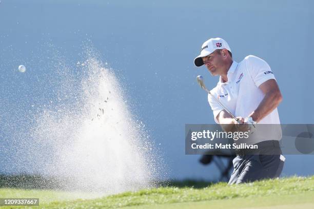 Brendan Steele of the United States plays a shot from a bunker on the 16th hole during the second round of the Honda Classic at PGA National Resort...