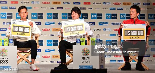 Suguru Osako, Yuta Shitara and Hiroto Inoue of Japan attend the Tokyo Marathon press conference on February 28, 2020 in Tokyo, Japan.
