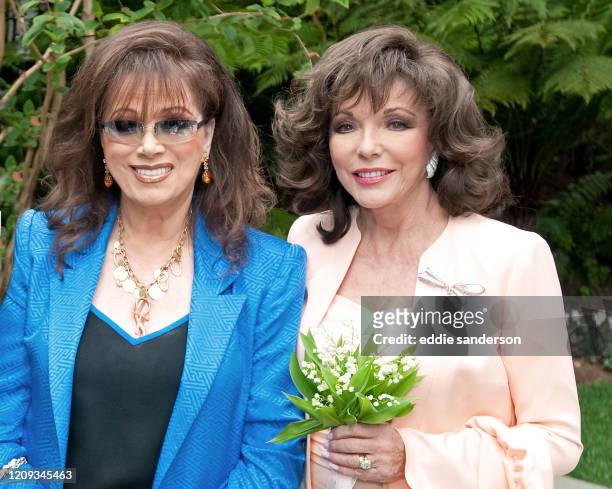 Joan Collins with her sister Jackie Collins after renewing her wedding vows with husband Percy Gibson at the Hotel Bel Air in Los Angeles in March...