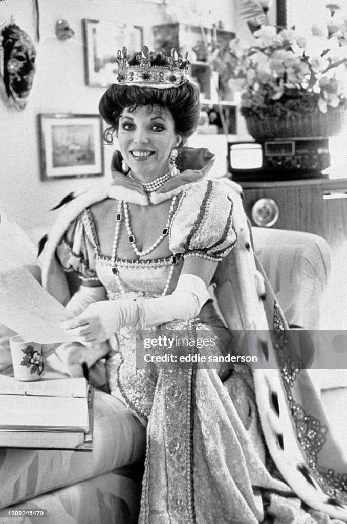 Actress Joan Collins Dressed As A European Queen In Hollywood, California.
