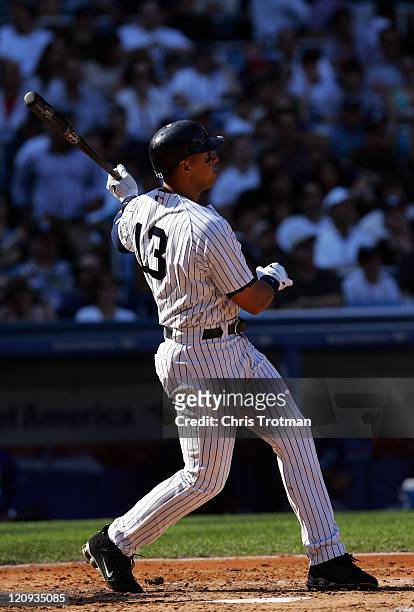 Alex Rodriguez of the New York Yankees homers on a fly ball to left field in the 3rd inning to score teammate Jason Giambi against the Kansas City...