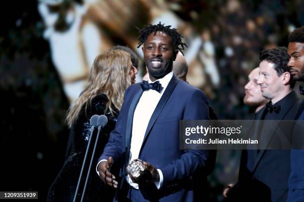 Ladj Ly receives the best film award for 'Les Misérables' on stage during the Cesar Film Awards 2020 Ceremony At Salle Pleyel In Paris on February...