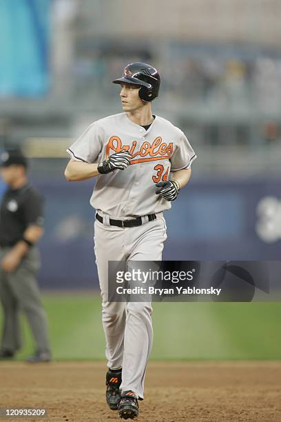 Kris Benson of the Baltimore Orioles rounding bases after hitting home run during MLB regular season game against the New York Mets, played at Shea...