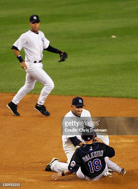 Miguel Cairo of the New York Yankees tags out Jose Valentin of the New York Mets in the 5th inning at Yankee Stadium on June 30, 2006 in New York....