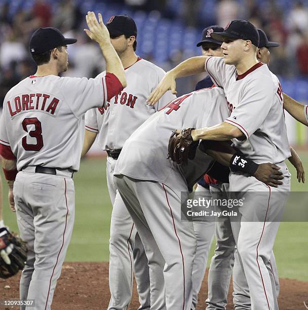 Boston Red Sox David Ortiz hands out unique congratulations to P Jonathan Papelbon after he recorded his 19th save in Boston's 8-6 victory over the...