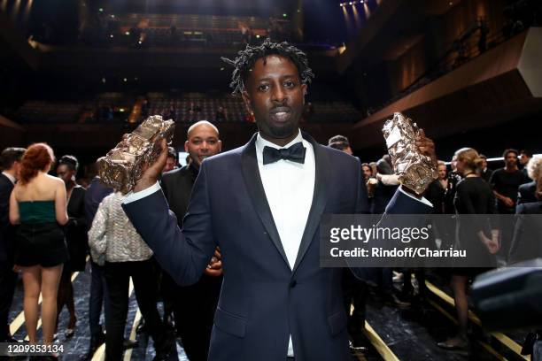 Ladj Ly who receives the “Best People Choice” award and the Best Film award for 'Les Misérables" attend the Cesar Film Awards 2020 Ceremony at Salle...