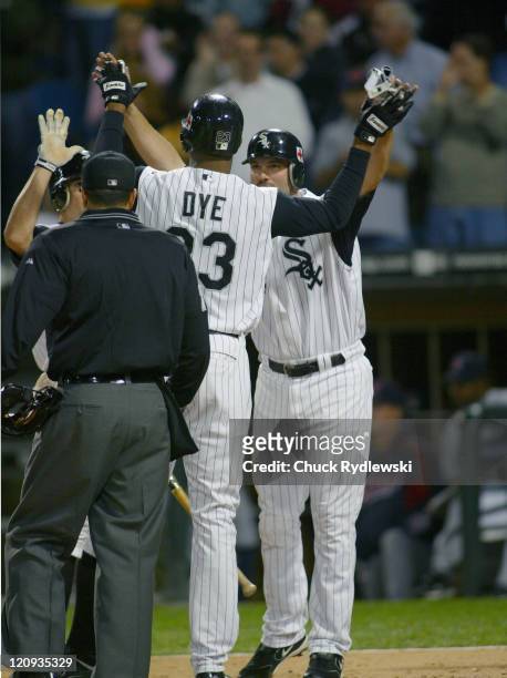 Chicago White Sox Right Fielder, Jermaine Dye, is greeted at home plate by Paul Konerko following his 3- run 2nd inning home run during the game...