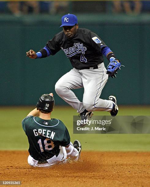 Tampa Bay's Nick Green is forced out at second as Angel Berroa leaps to get out of the way during Sunday's action at Tropicana Field in St....