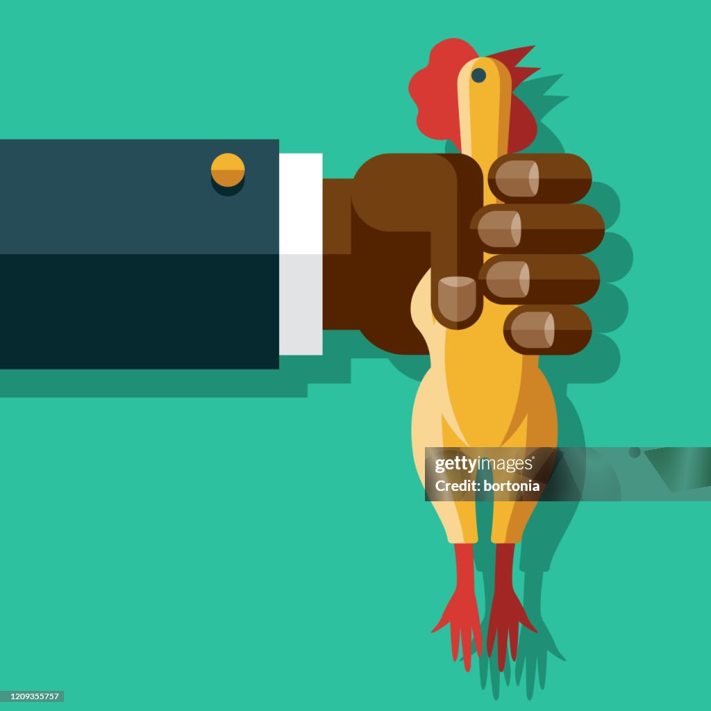 Hand Holding Rubber Chicken Toy
