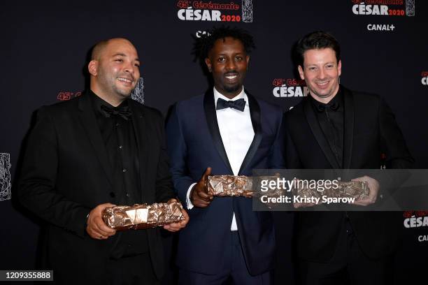 Toufik Ayadi, Ladj Ly and Christophe Barral pose with the Best Film award for the movie 'Les Miserables' during the Cesar Film Awards 2020 Ceremony...