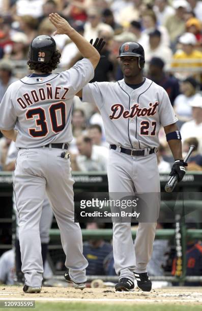 Detroit Tigers Magglio Ordonez and Craig Monroe celebrate after teammate Carlos Guillen's 2 run homer in the first inning of play against Pittsburgh...