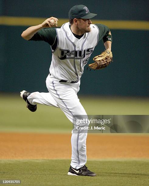 Tampa Bay's Aubrey Huff makes a off-balance throw to get the out in Friday night's game against Atlanta at Tropicana Field in St. Petersburg, Florida...