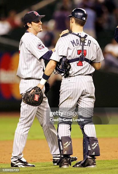 Minnasota Twins closer Joe Nathan gives a high five after another successful inning of work. The Twins won the game in Phoenix at Bank One Ballpark...